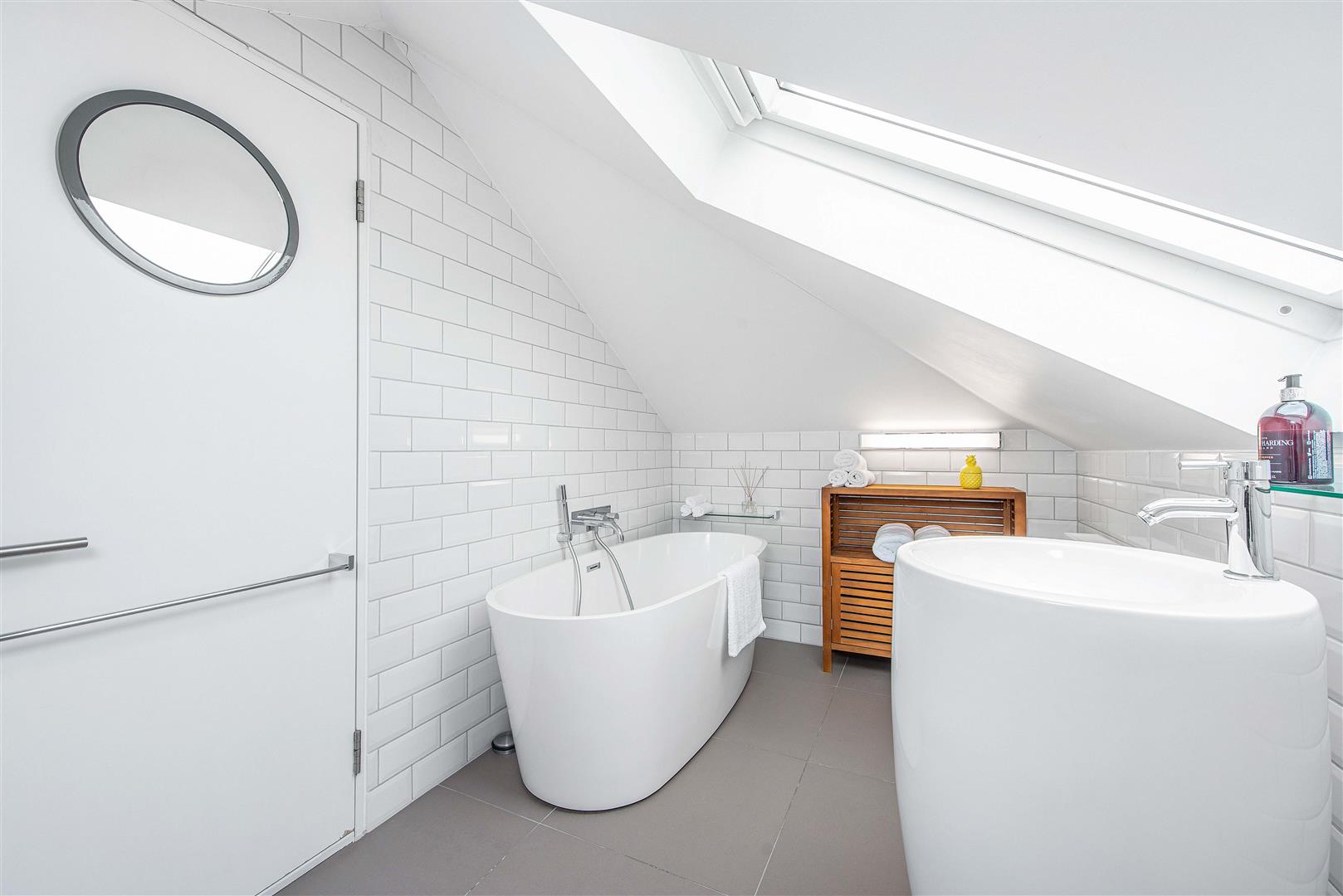 A photo of recently converted loft bathroom from a property currently for sale at Davies & Davies